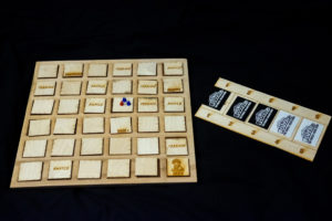 Laser-cut tile grid on the wooden board